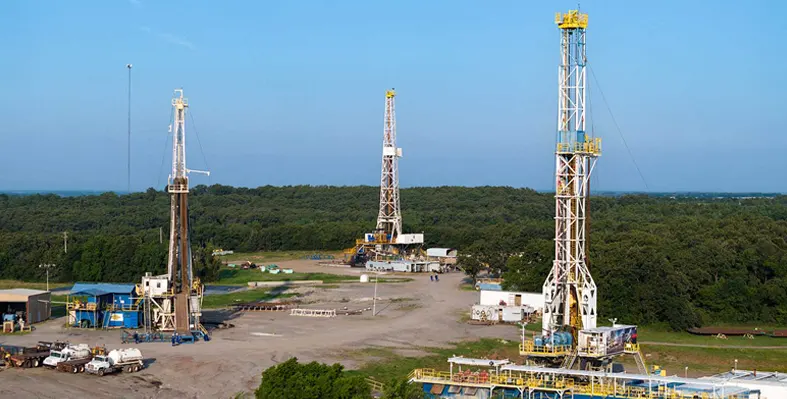 Image of three drilling rigs 