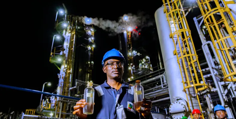 A refinery worker showing products ready to be delivered 