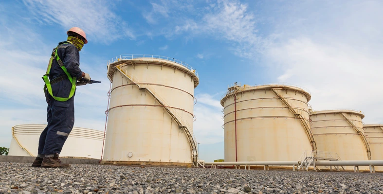 engineer inspecting oil & gas storage space 